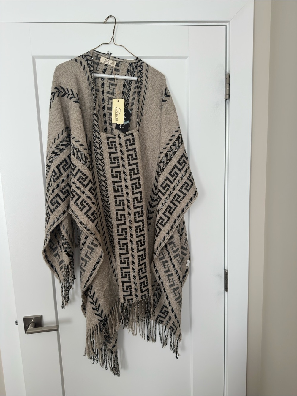 Beige and Black Patterned Fringe pullover cape.